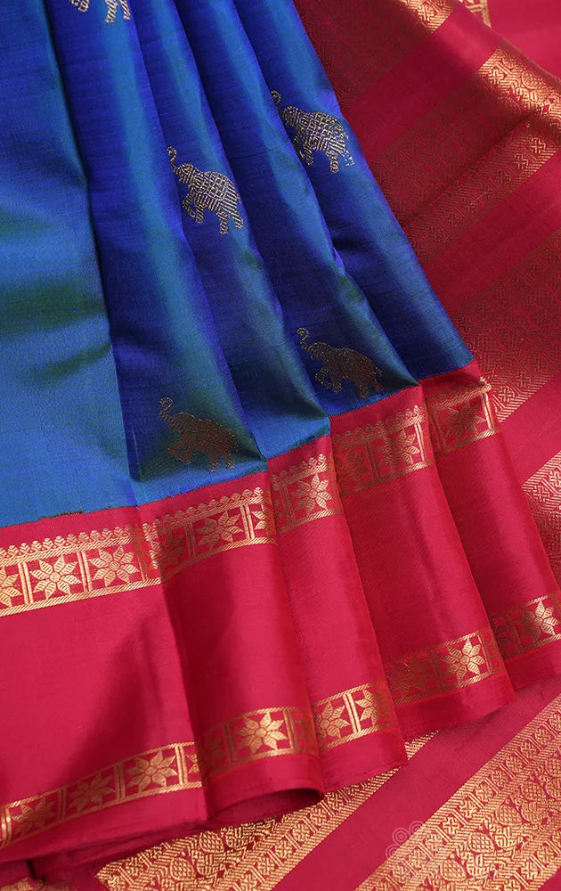 Peacock blue kanchipuram silk saree with korvai rettaipet border