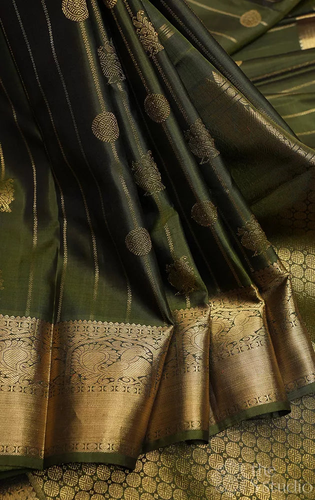 Mehandi green kanchi pattu saree with vertical vangi designs