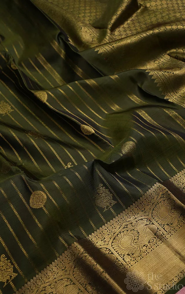 Mehandi green kanchi pattu saree with vertical vangi designs