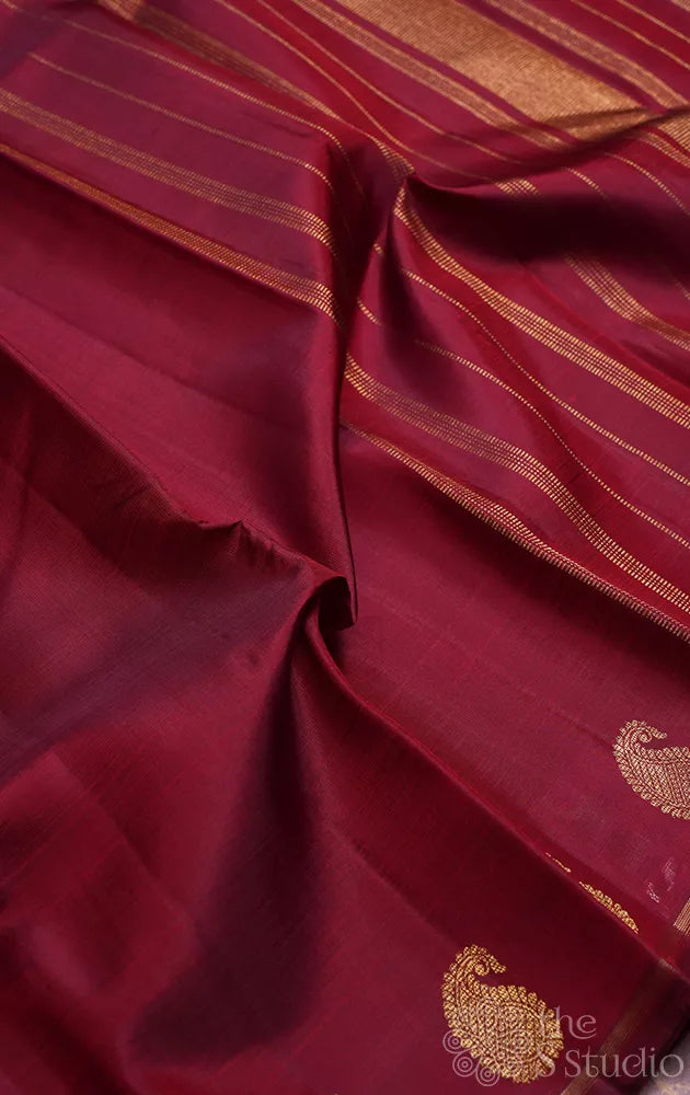 Maroon kanchi silk saree with mango motifs along the border