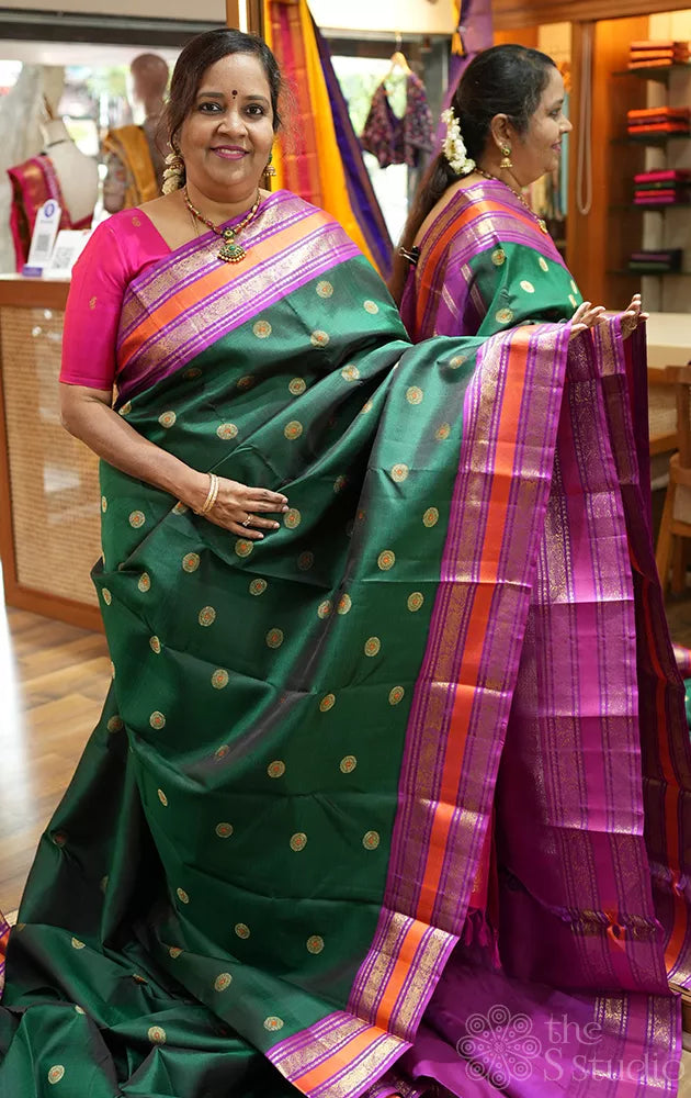 Green korvai kanchipuram silk saree with purple border