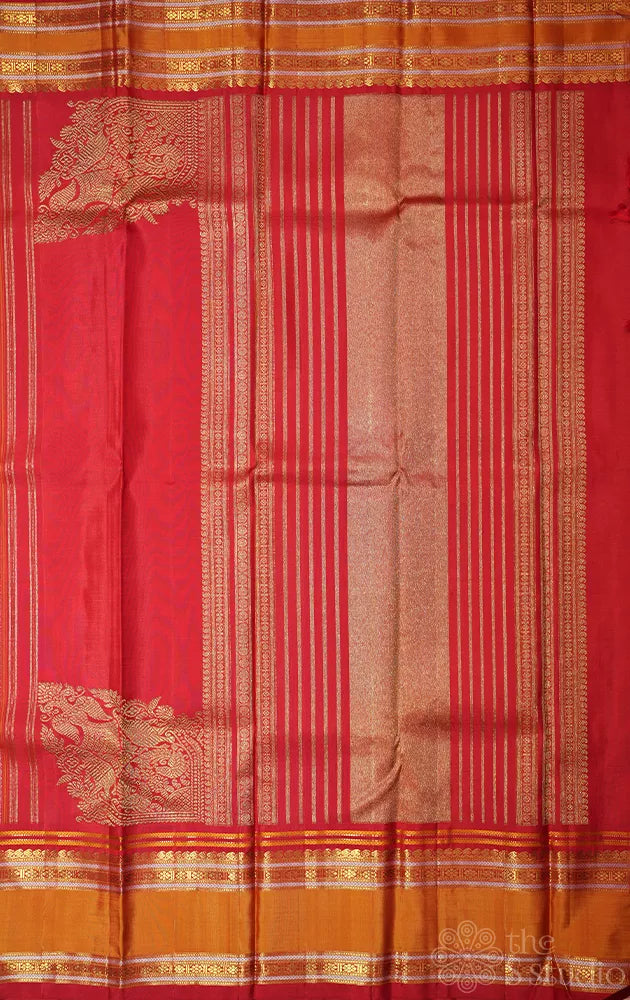 Red kanjivaram saree with thread woven body and a zari rich border