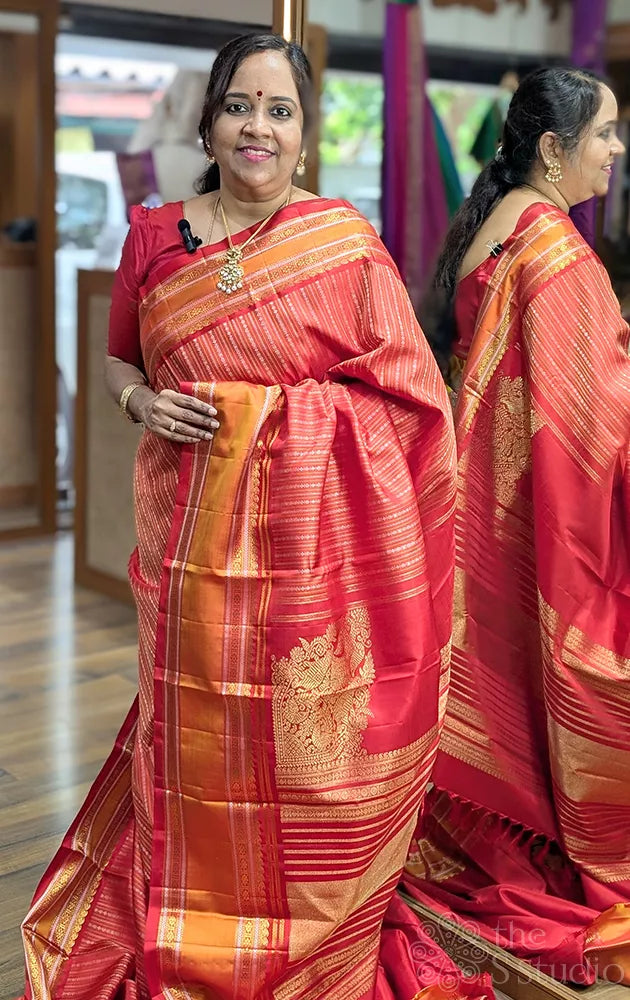 Red adai kanjivaram silk saree with thread woven body and rettaipet border