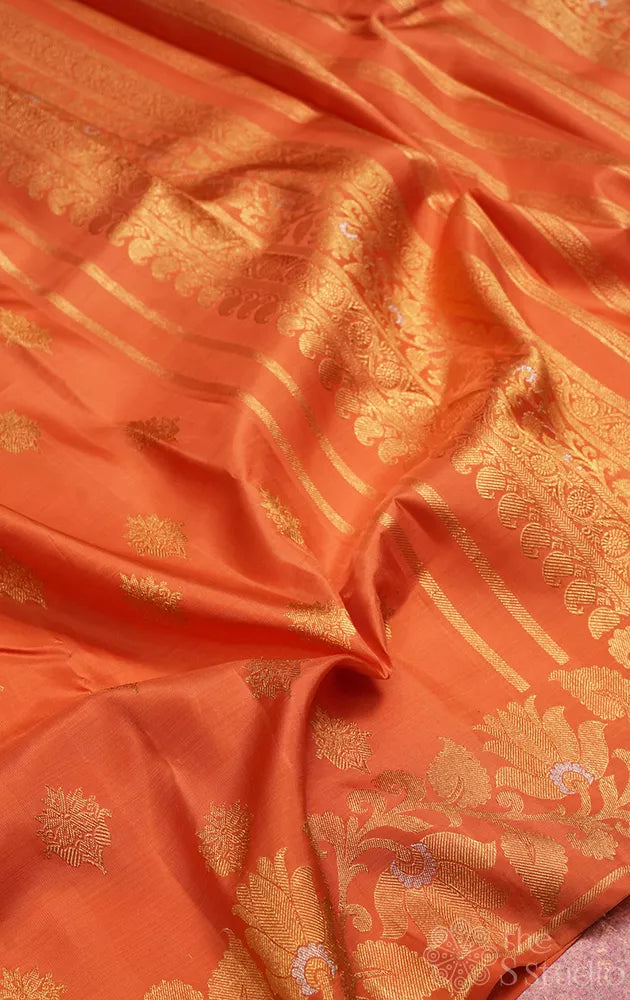 Orange Kanchipuram silk saree with floral weave border