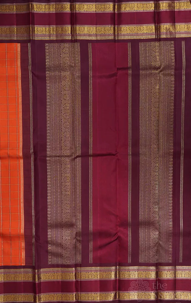 Orange kanjivaram silk saree with zari checks and korvai brown border