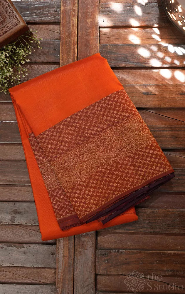 Burnt orange kanchipuram silk saree with maroon border