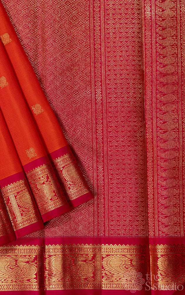 Orange kanjivaram silk saree with small rani pink border