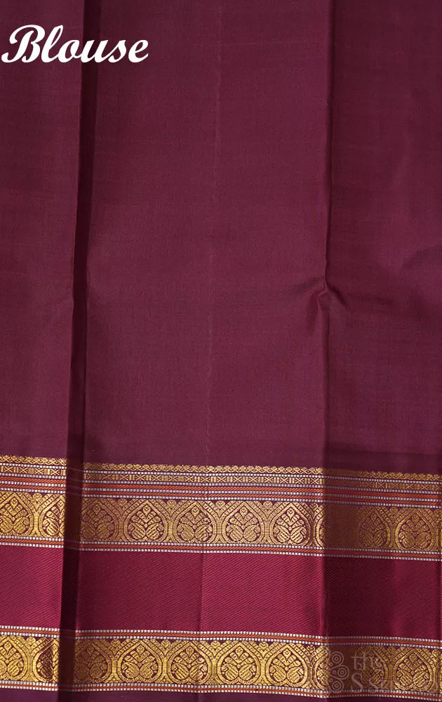 Yellow kanjivaram silk saree with zari checks and korvai brown border