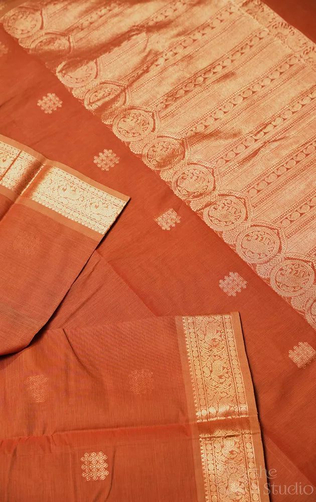 Rust handloom kanchi cotton saree with zari woven border