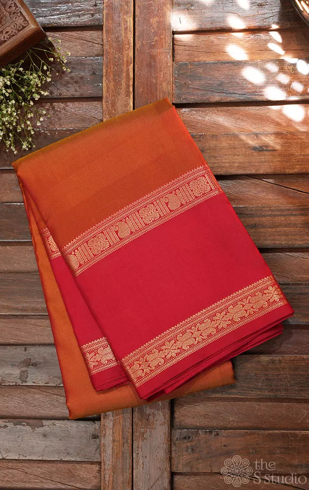 Rust kanchi silk saree with rettaipet red coloured border