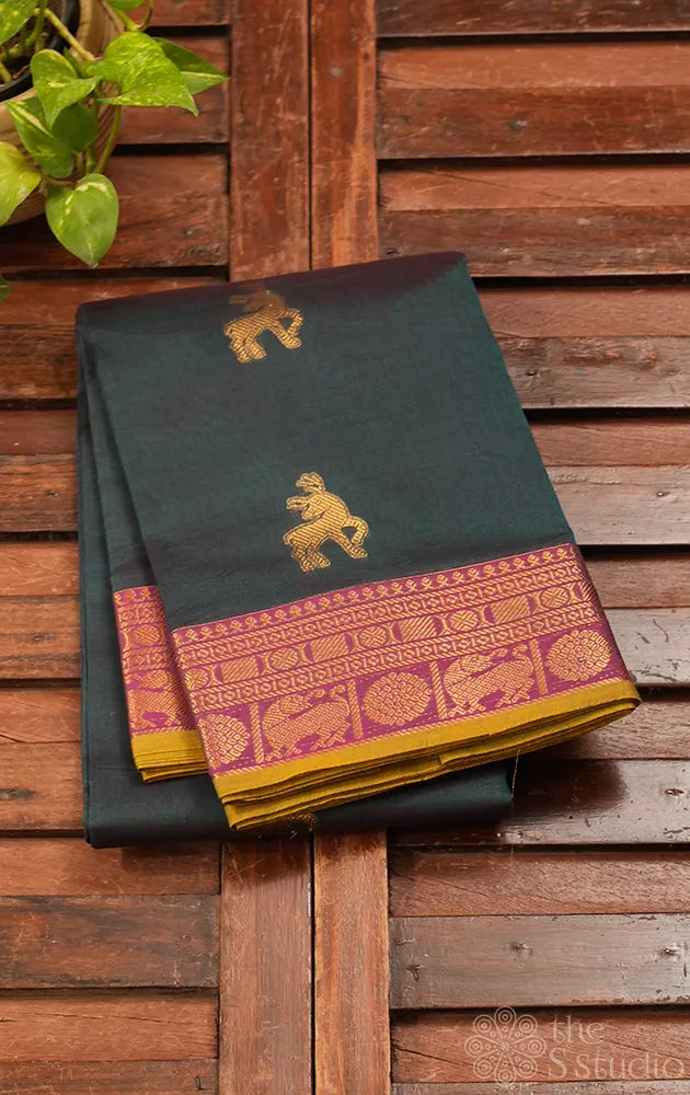Teal green handloom kanchi cotton saree with deer butta and magenta border.