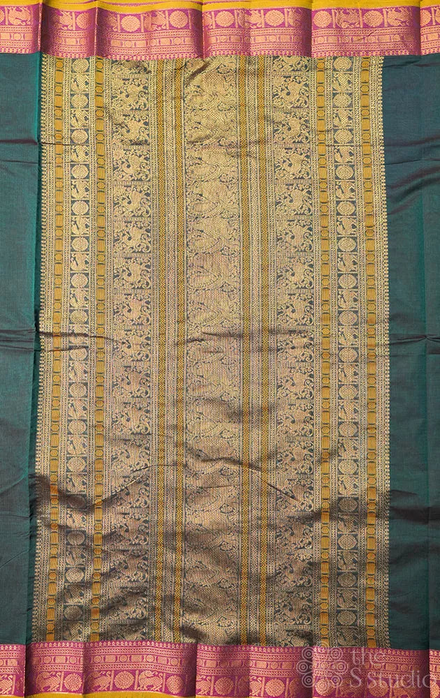 Teal green handloom kanchi cotton saree with deer butta and magenta border.