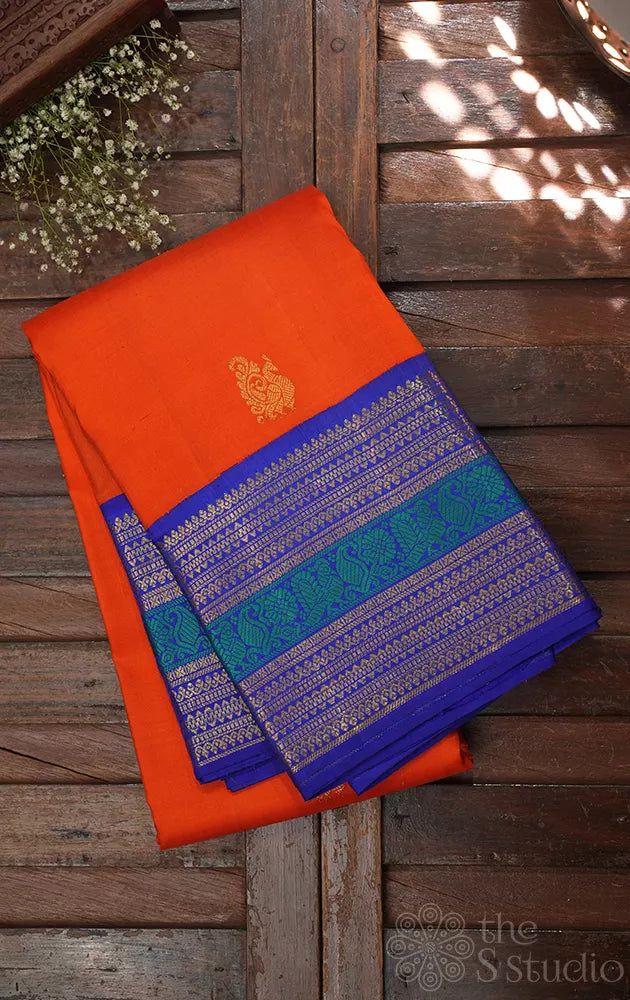 Fanta orange kanchipuram silk saree with korvai blue border