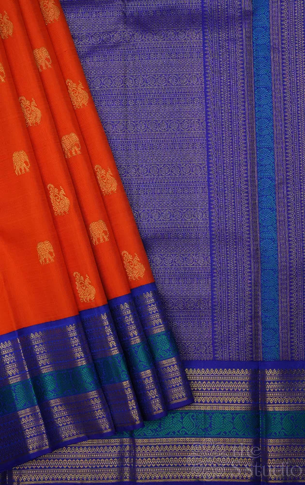 Fanta orange kanchipuram silk saree with korvai blue border