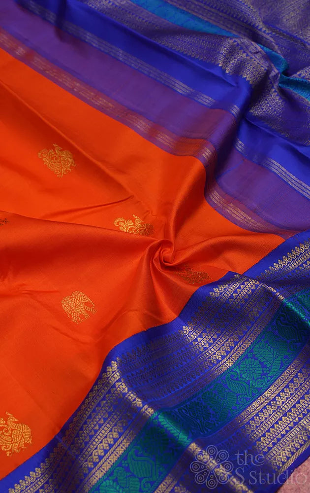 Fanta orange kanchipuram silk saree with korvai blue border