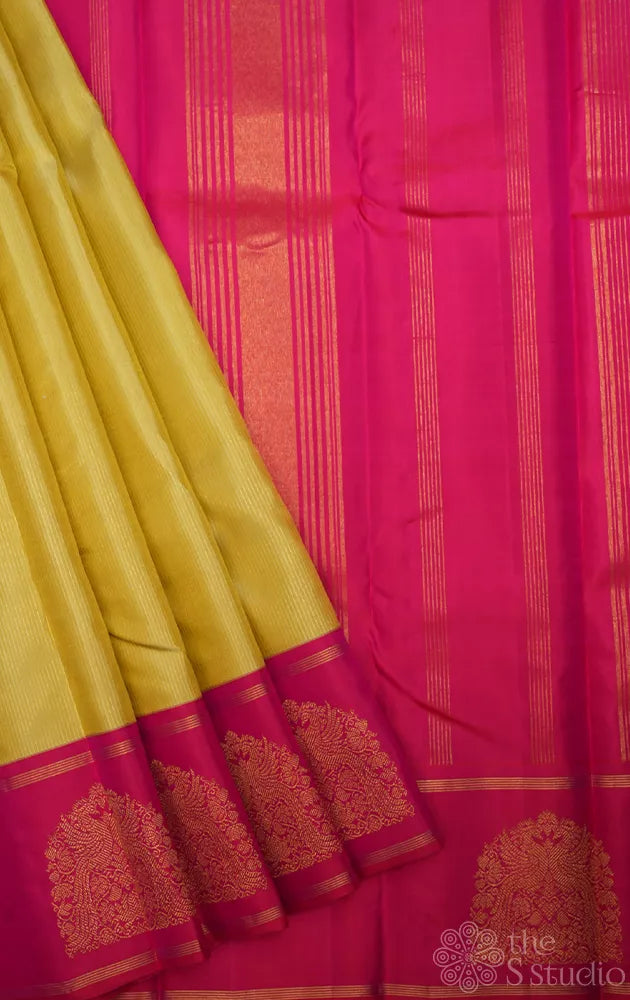 Light elachi green kanchipuram silk saree with ranipink border