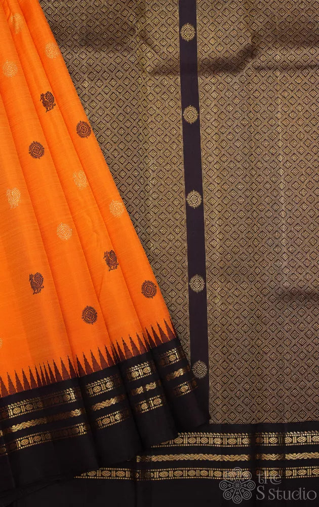 Orange kanjivaram silk saree with korvai brown border