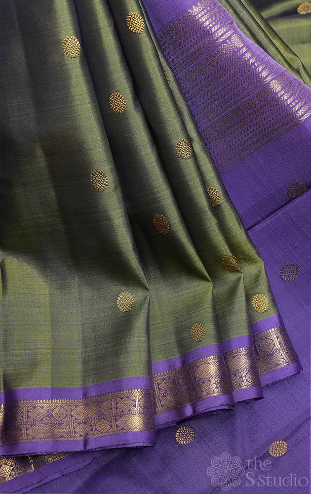 Olive green kanchi pattu saree with lavendar border and pallu