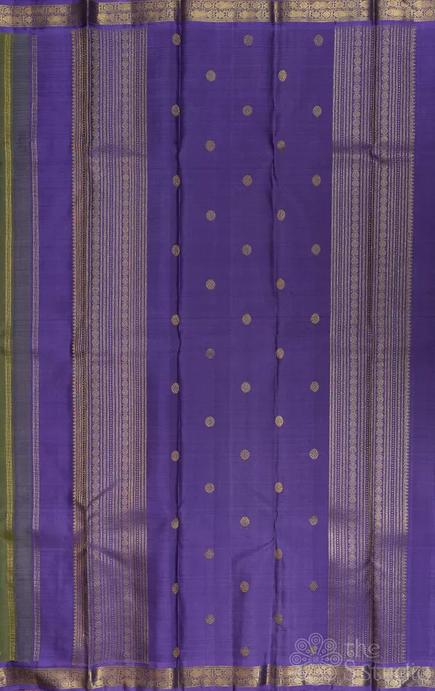 Olive green kanchi pattu saree with lavendar border and pallu