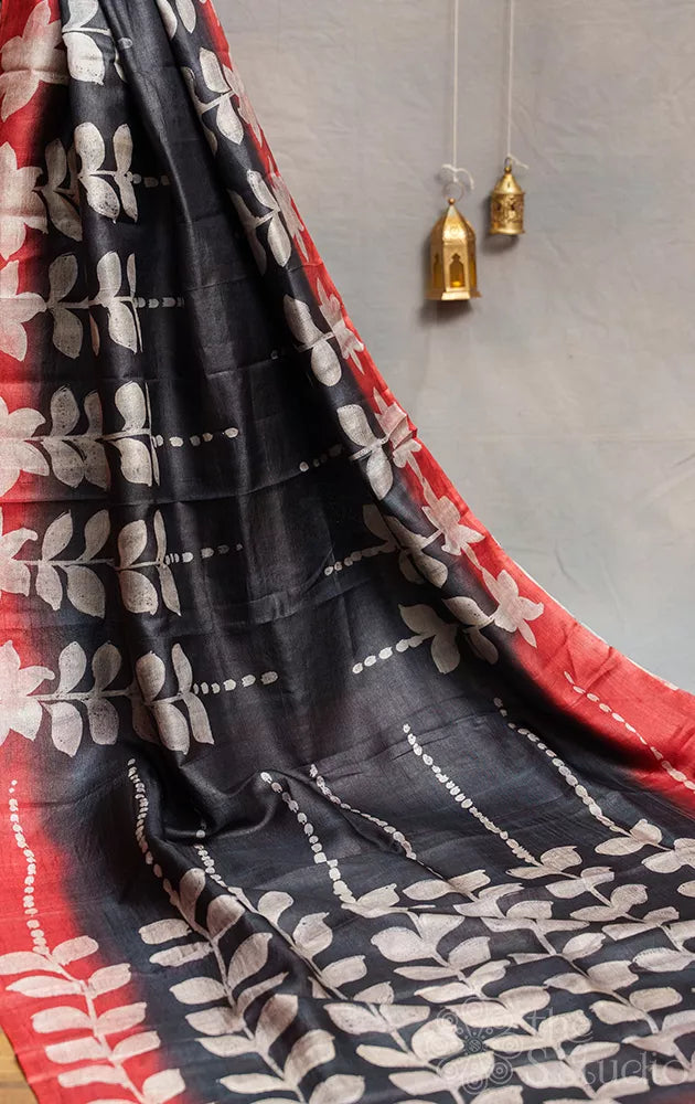 Black tussar silk saree with red border and batik prints