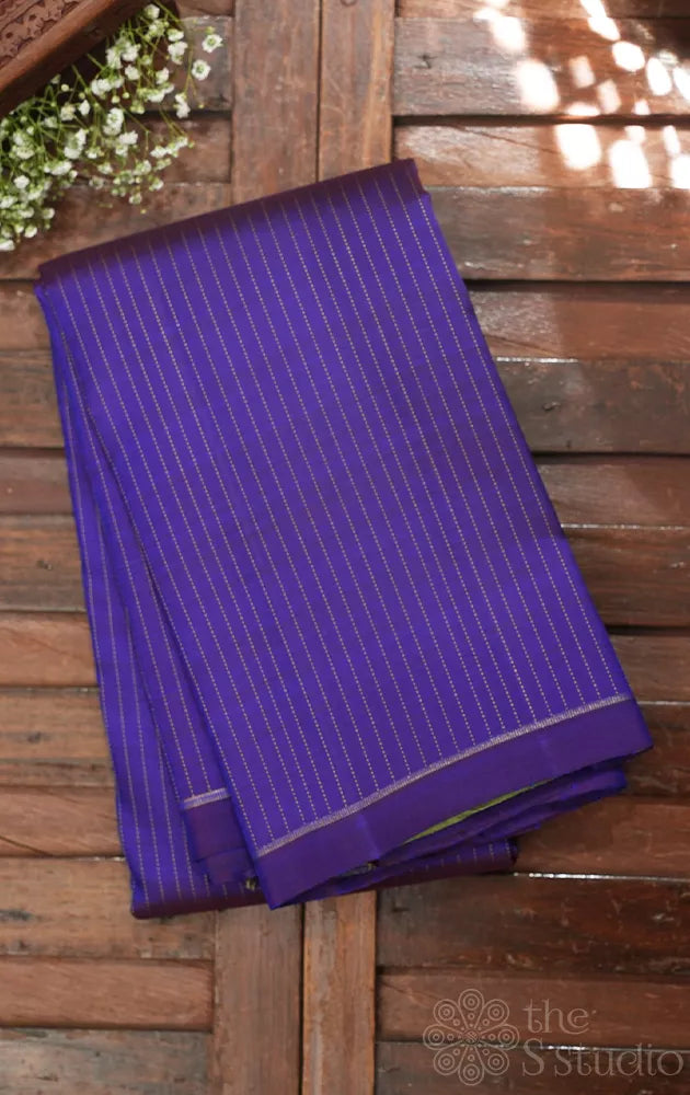 Violet borderless Kanchipuram silk saree with contrast elaichi green pallu