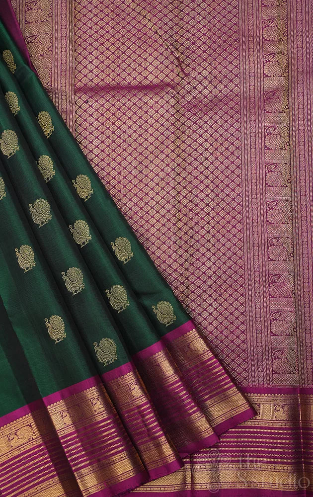 Bottle green kanjivaram silk saree with magenta border