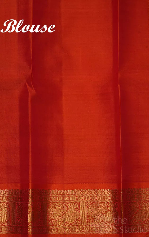 Leaf green kanchi pattu saree with korvai orange border