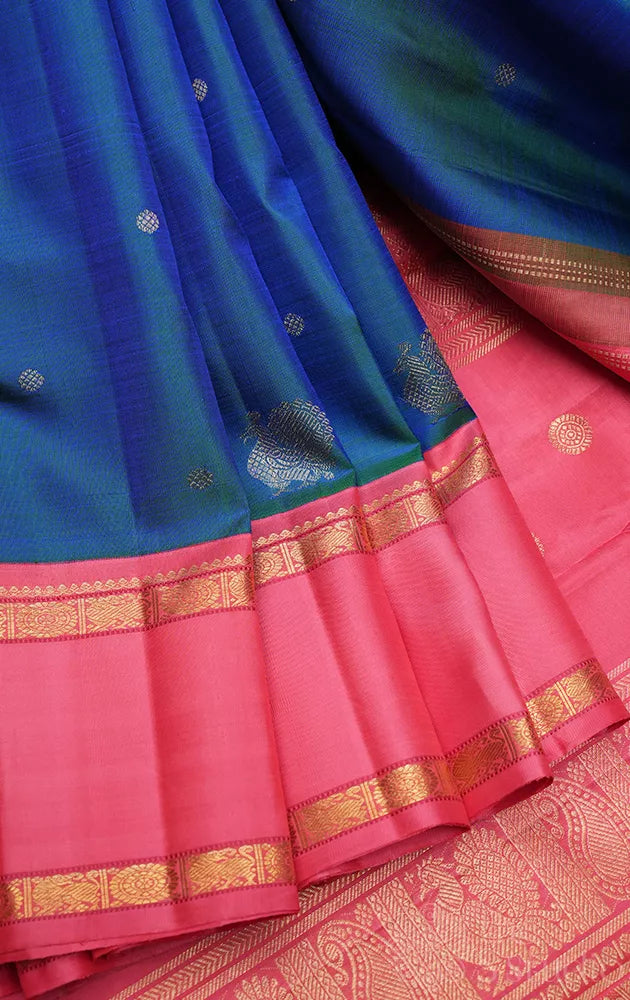 Peacock blue kanjivaram silk saree with korvai bubble gum pink border
