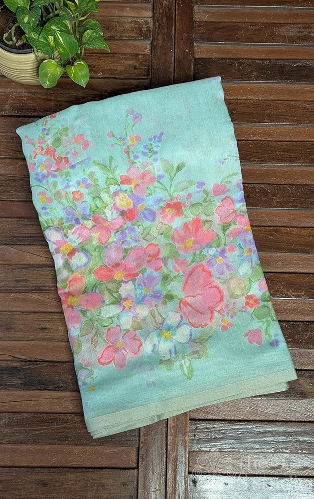 Light green linen saree with peach floral prints