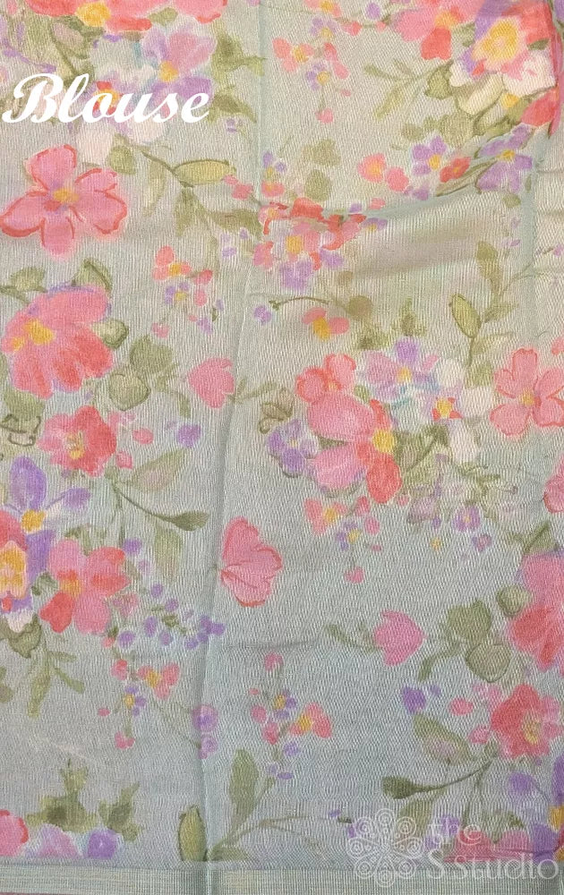 Light green linen saree with peach floral prints