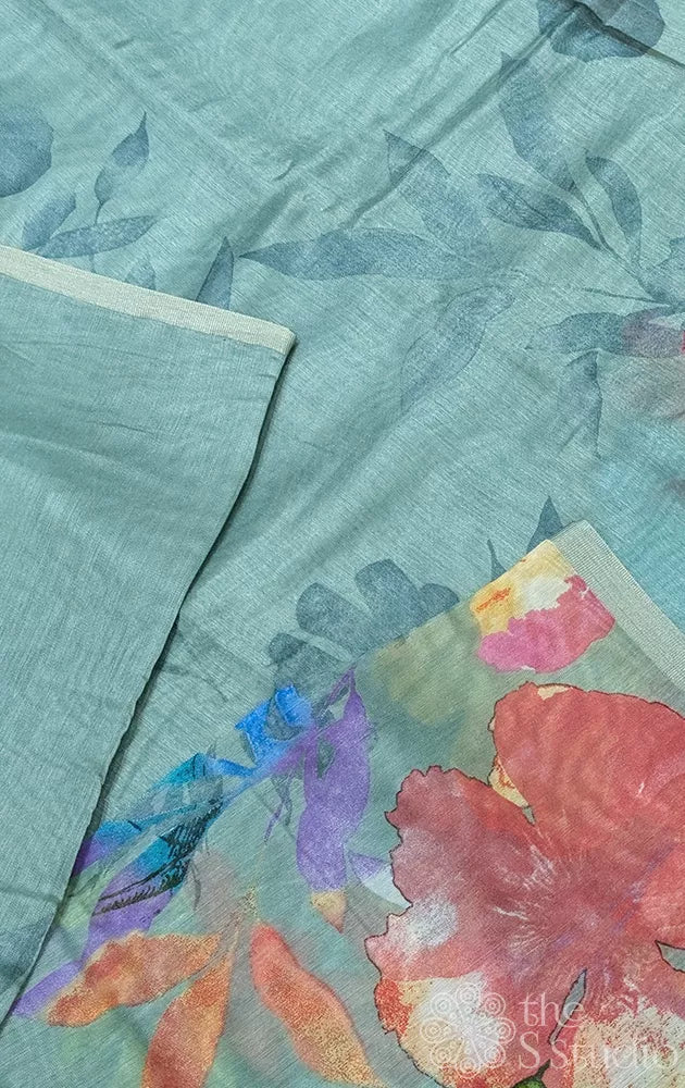 Sage green linen saree with floral prints
