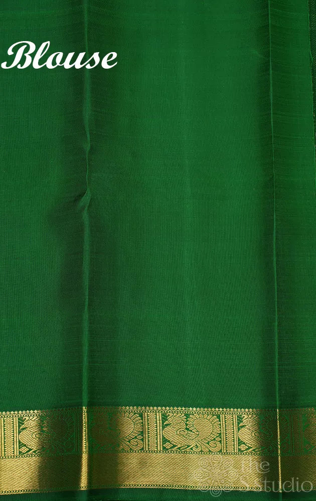 Leaf green kanjivaram silk saree with zari checks and meenakari buttas