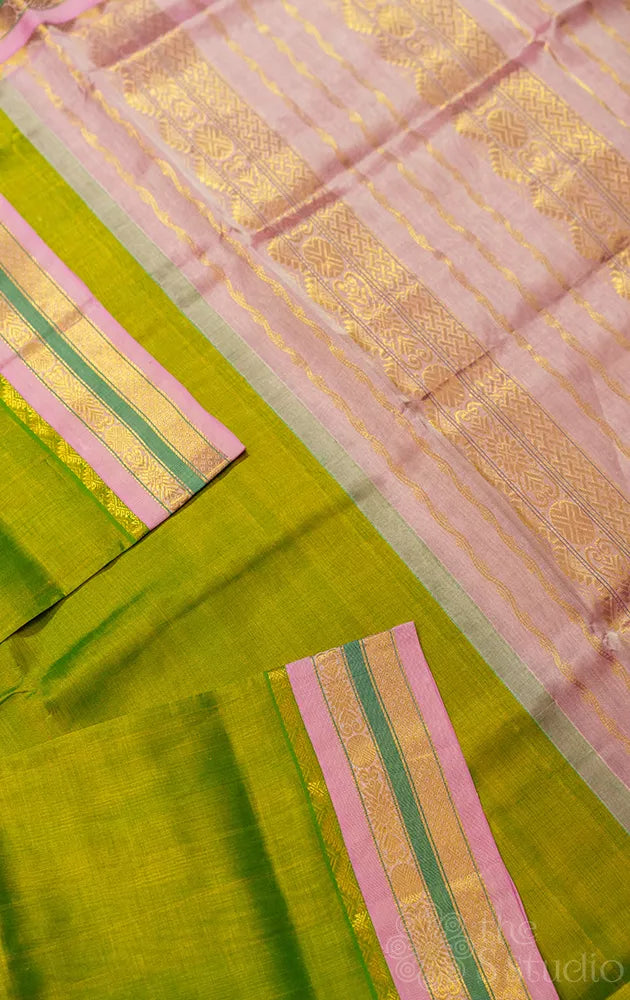 Light green kanchipuram silk cotton saree with pink border