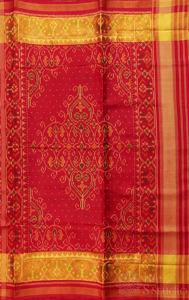 Red patola silk saree with all over ikat design and tissue border