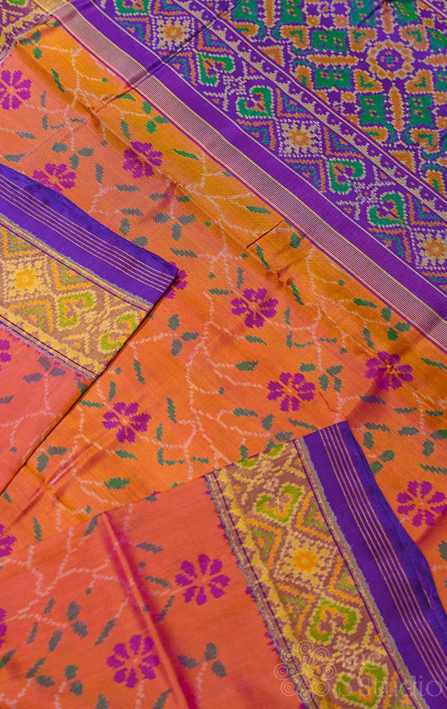 Peach patola pattu saree with woven floral motifs and tissue border
