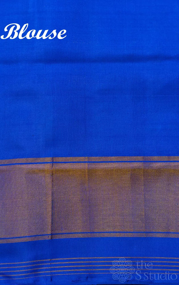 Orange patola silk saree with blue border in ikat design