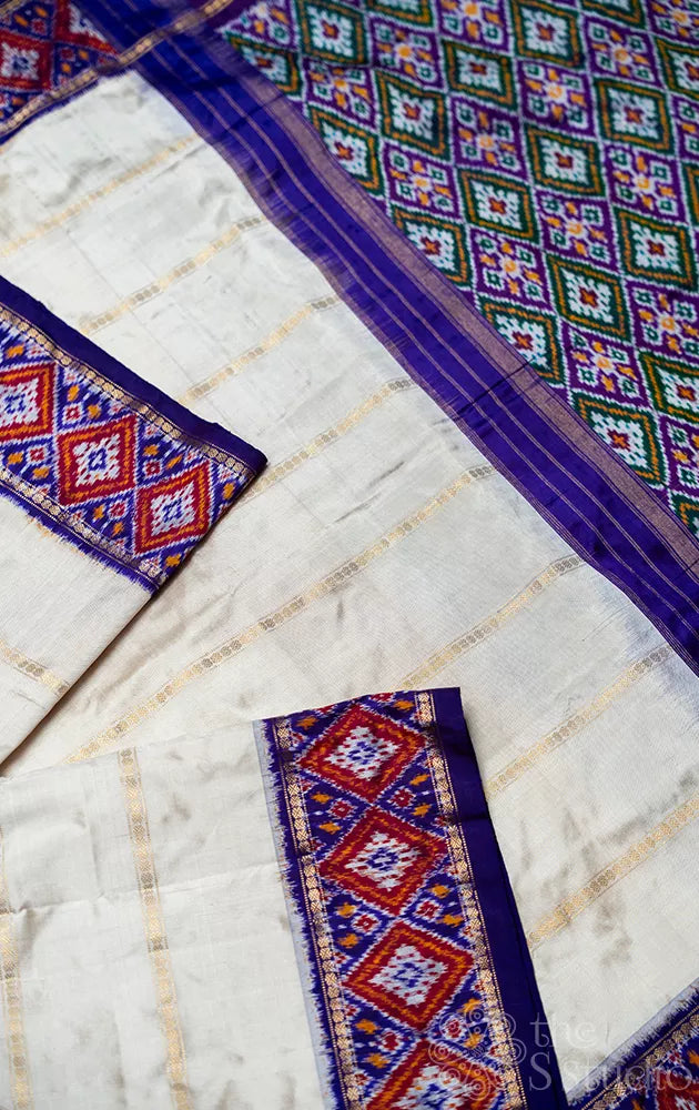Off white ikkat silk saree with geometric violet border
