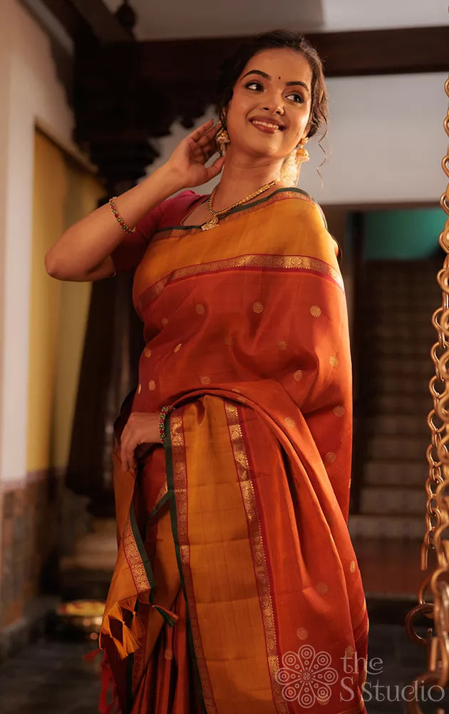 Rust kanchipuram silk saree with rettaipet border