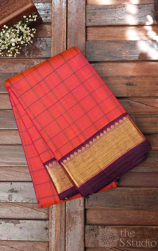 Peachish orange checked kanjivaram silk saree with purple zari border