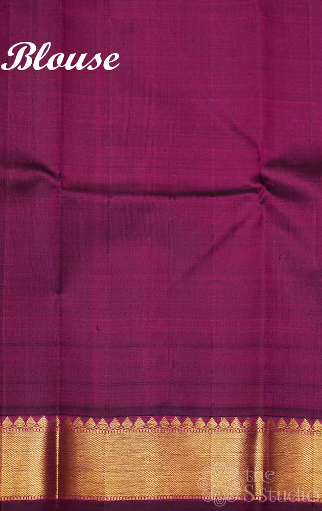 Peachish orange checked kanjivaram silk saree with purple zari border