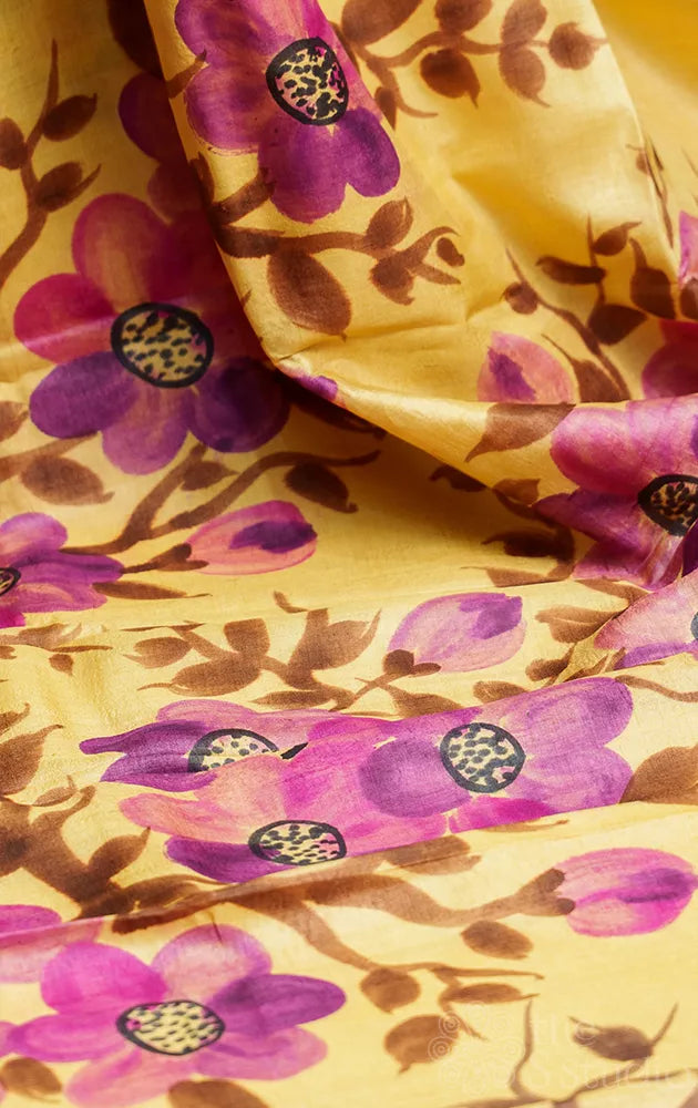 Light yellow tussar silk saree with floral batik prints and hand painting