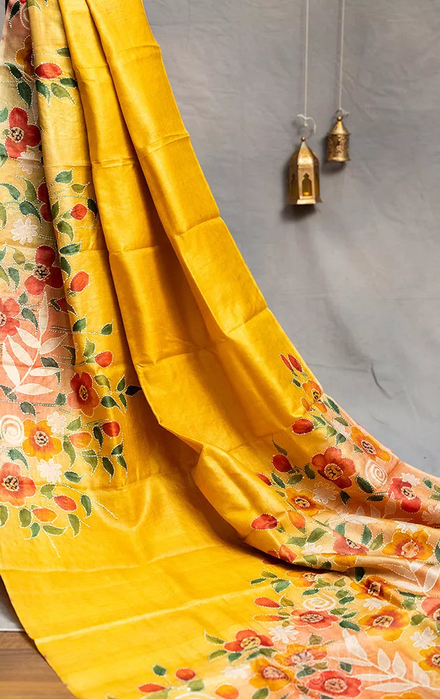 Yellow tussar silk saree with floral hand painting and hand embroidery