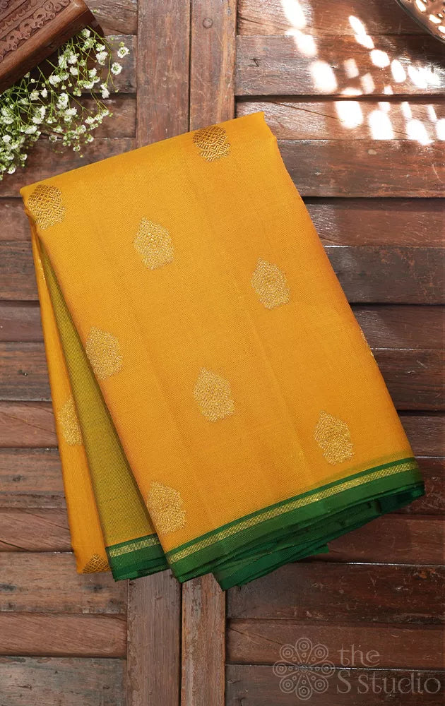 Mustard yellow kora Kanchipuram silk saree with zari buttas