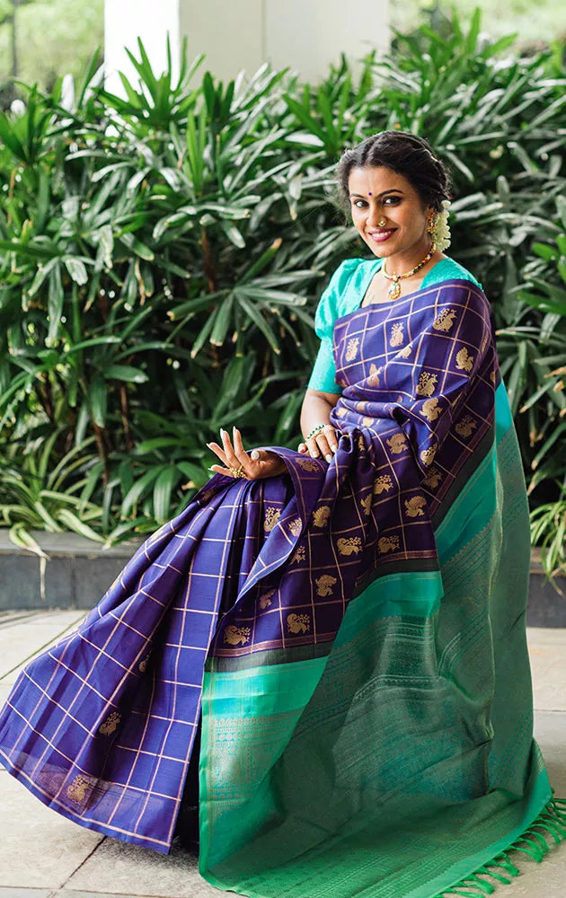 Aubergine colour kanchi pattu saree with checks and buttas