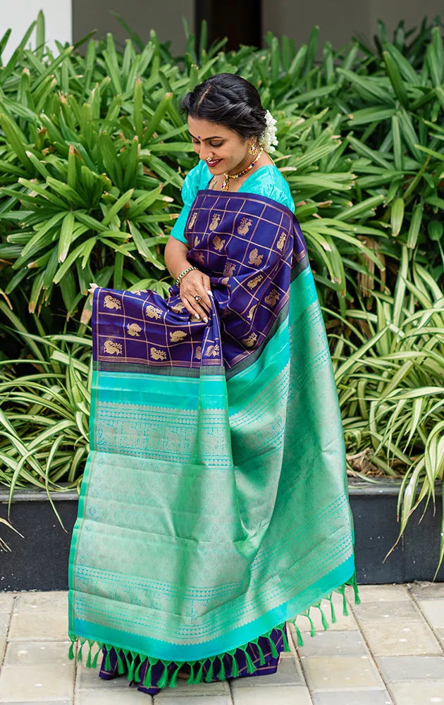 Aubergine colour kanchi pattu saree with checks and buttas