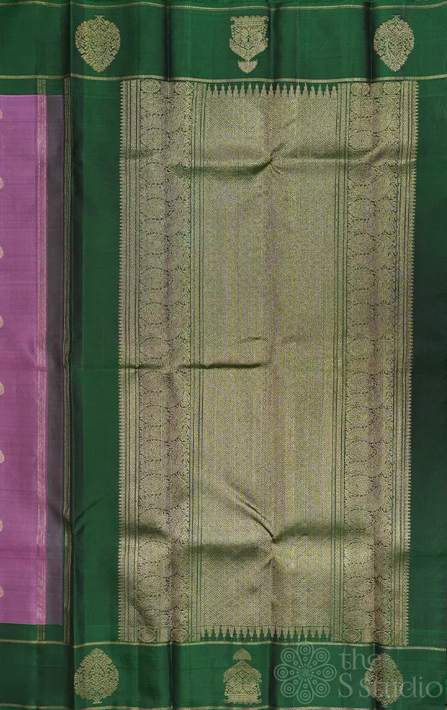 Lavendar kanjeevaram silk saree with green butta woven border