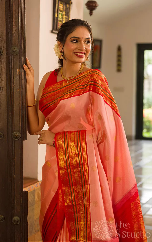 Light peach kanchi silk saree with ganda berunda motifs and korvai red borde