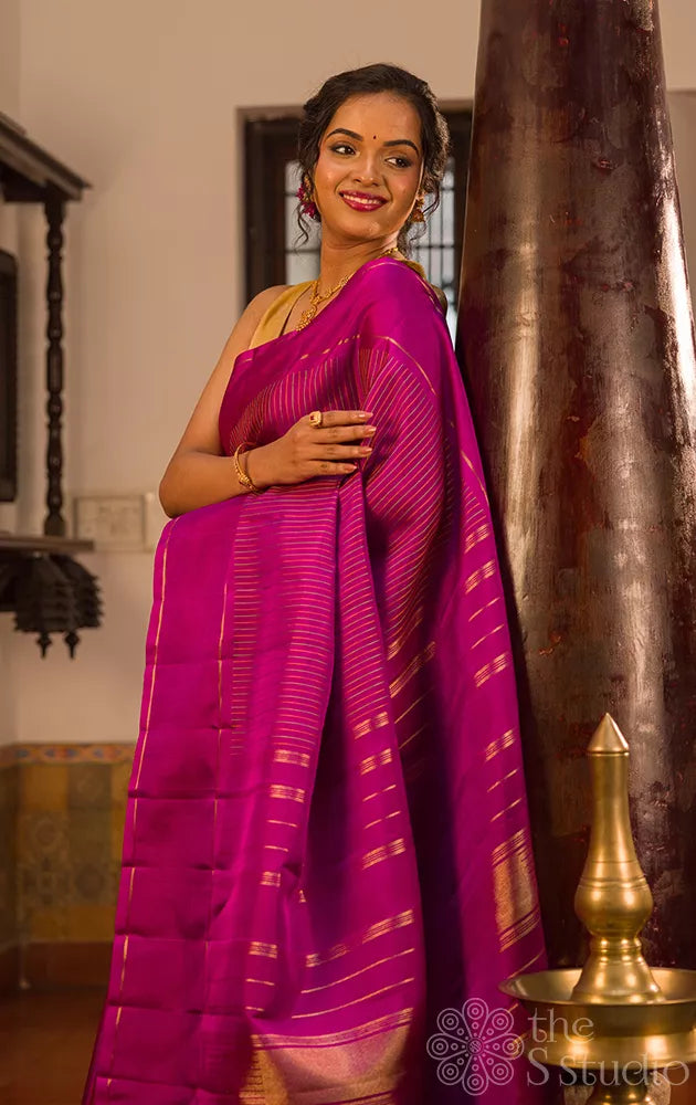 Purple kanjivaram silk saree with thread lines and simple zari border