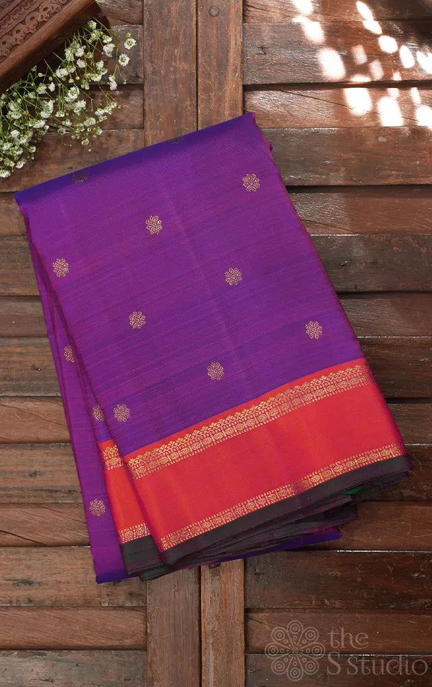 Purple kanjivaram silk saree with buttas and peach border