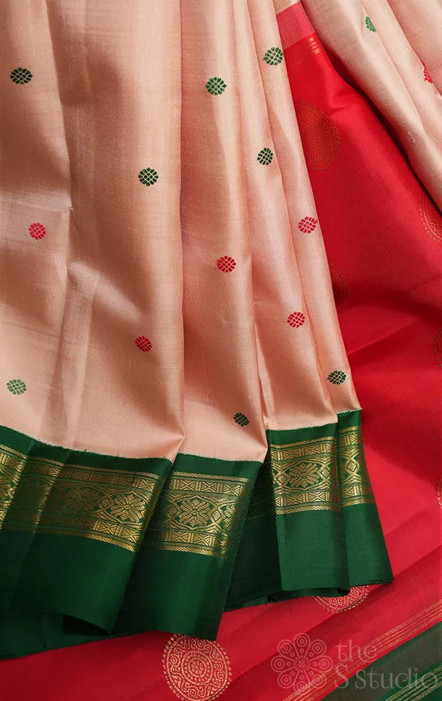 Light peach korvai kanjivaram silk saree with red and green korvai border